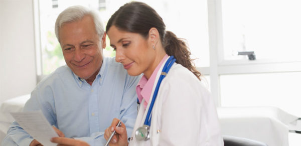 doctor reviewing documents with patient