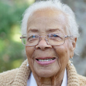 elderly woman smiling at the camera