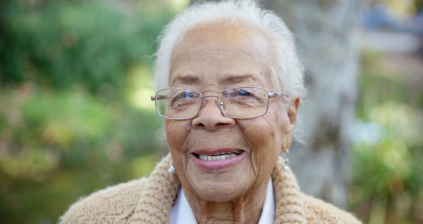 elderly woman smiling at the camera